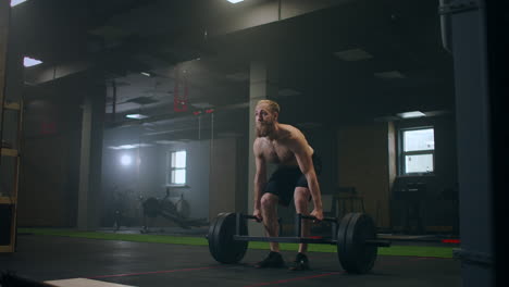 Athletic-Beautiful-man-Does-Deadlift-with-a-Barbell-in-the-Gym.-Gorgeous-male-Professional-Bodybuilder-Workout-Weight-Lift-Exercises-in-the-Authentic-Fit-Training-Facility.